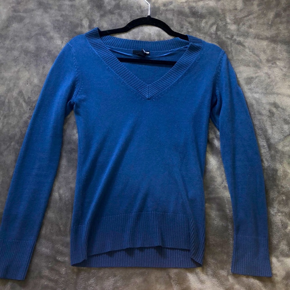 Blue long sleeve sweater/shirt.